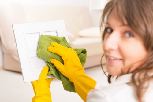 Technician managing hoses and equipment safely during carpet cleaning